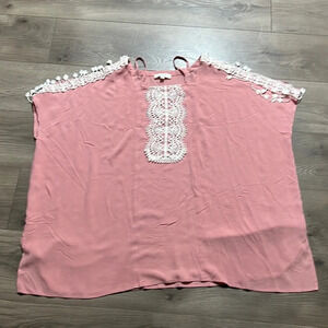 Umgee shirt. Has cold shoulder sleeves.